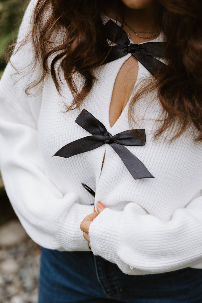 White Sweater with Black Bows