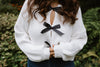 White Sweater with Black Bows